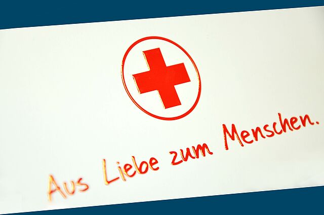 Spendengutschein: Rotes Kreuz und der Text "Aus Liebe zum Menschen"